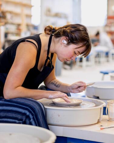 Ana Matsubara practices her craft before a class at Still Life, a pottery studio and store, in the Arts District neighborhood in downtown Los Angeles on Friday, Jan. 12, 2024. 