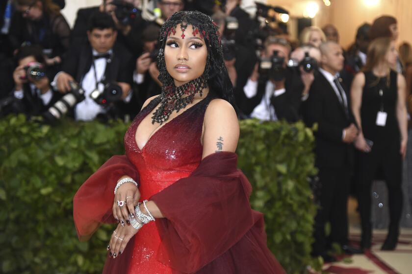 Nicki Minaj attends The Metropolitan Museum of Art's Costume Institute benefit gala celebrating the opening of the Heavenly Bodies: Fashion and the Catholic Imagination exhibition on Monday, May 7, 2018, in New York. (Photo by Evan Agostini/Invision/AP)