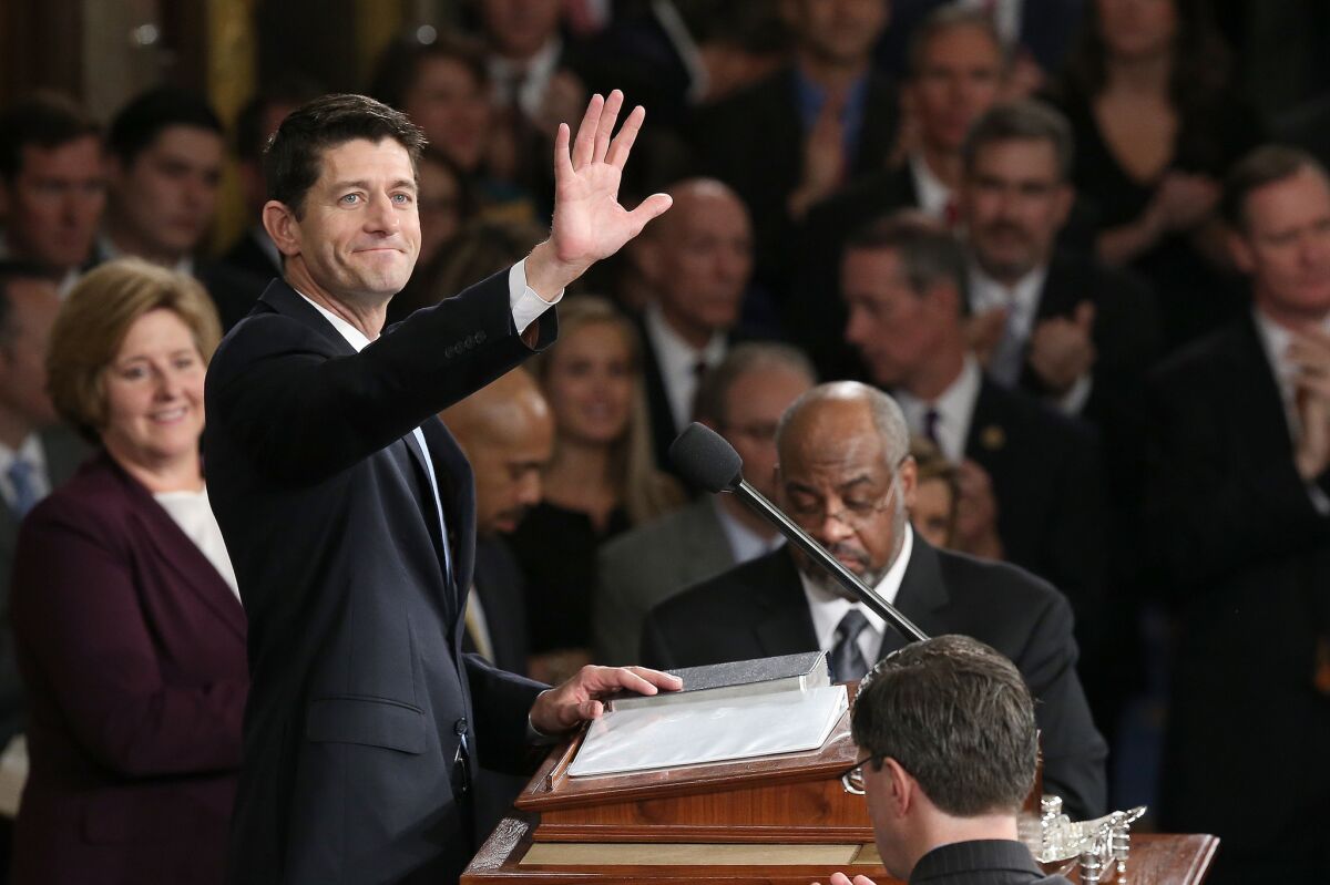 Newly sworn-in Speaker of the House Paul Ryan waves to colleagues after his election to the leadership position on Oct. 29.