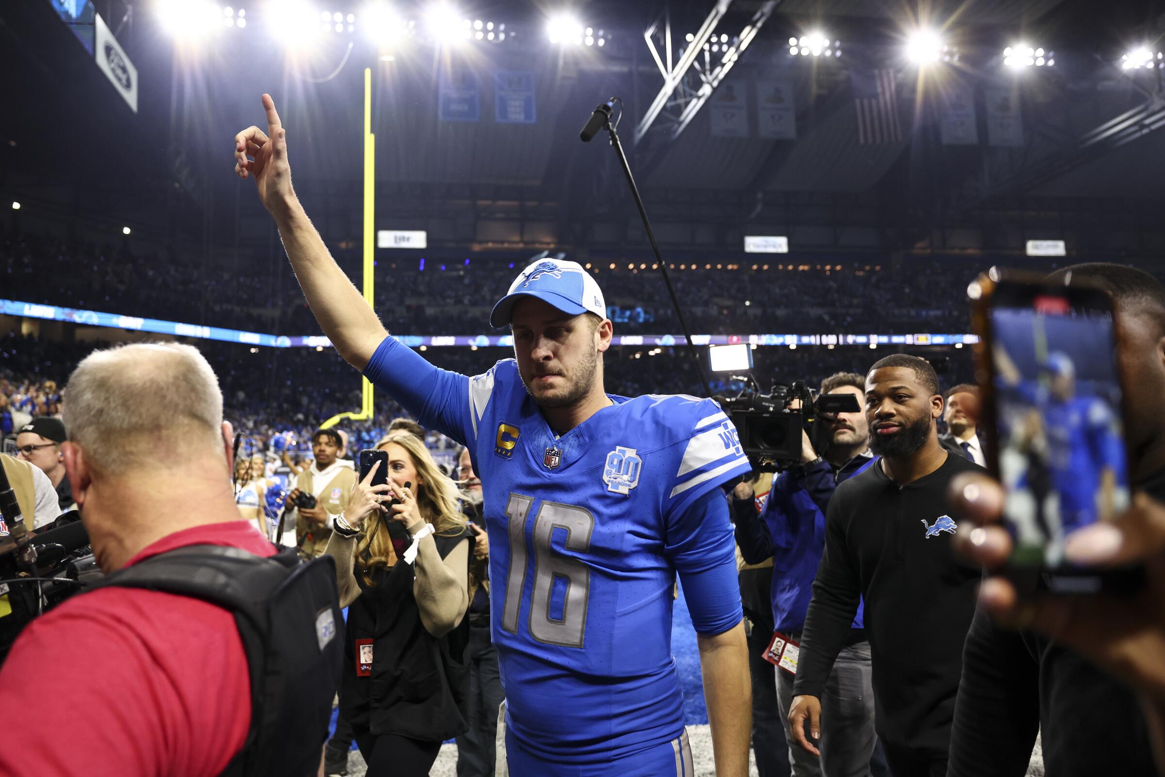 Detroit Lions quarterback Jared Goff celebrates while walking off the field after a 31-23 victory.
