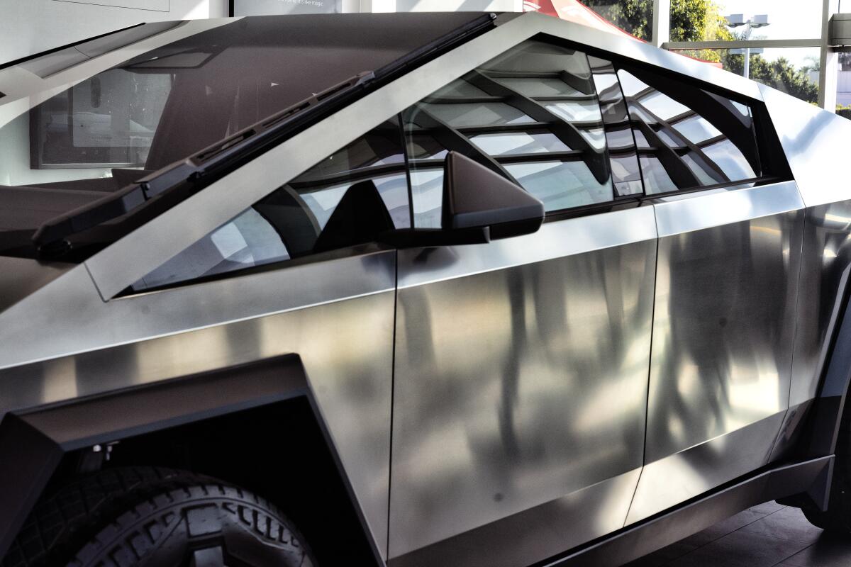 A Tesla Cybertruck is on display at Tesla in Buena Park, Calif. on Sunday Dec. 3, 2023. 