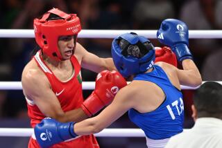 PARIS, FRANCE - AUGUST 1: Algeria's Imane Khelif (in red) during the Women's 66kg preliminary.