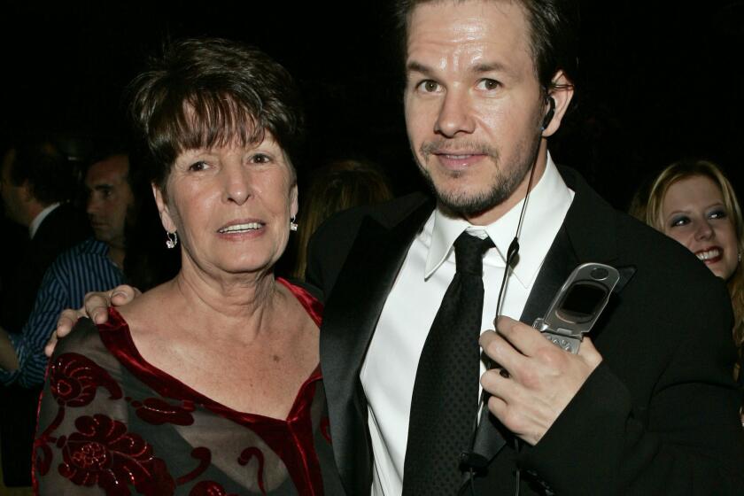 FILE - In this Sunday, Jan. 16, 2005, file photo, Mark Wahlberg, executive producer of the HBO series "Entourage," and his mother Alma pose at the HBO party after the 62nd Annual Golden Globe Awards, in Beverly Hills, Calif. Alma Wahlberg, the mother of entertainers Mark and Donnie Wahlberg and a regular on their reality series "Wahlburgers", has died, her sons said on social media Sunday, April 18, 2021. She was 78. "My angel. Rest in peace," Mark Wahlberg tweeted. (AP Photo/Lisa Rose, File)