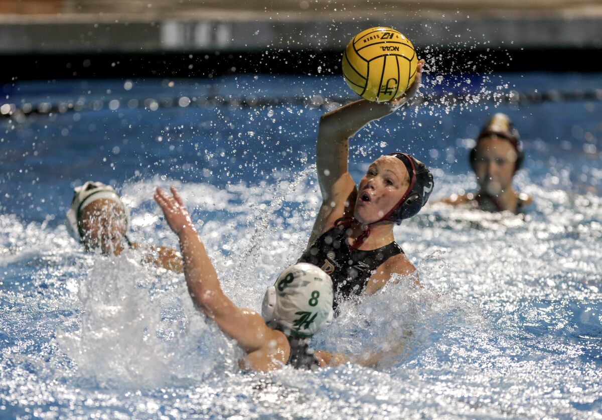 Bishop's Kendall Wyer looks to pass during the CIF San Diego Section Open Division girls water polo final against Helix.