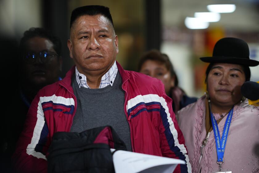 Former Jesuit Pedro Lima stops to talk to journalists after landing at El Alto international airport in El Alto, Bolivia, Monday, May 22, 2023, before traveling to the capital La Paz to make a statement at the public prosecutors office related to a church pedophilia scandal. Lima denounced pedophilia by the late Spanish Jesuit Priest, Alfonso Pedrajas, and was expelled from the Society of Jesus in 2001. (AP Photo/Juan Karita)