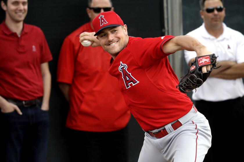 Angels sidearm reliever Joe Smith throws during a spring training workout.