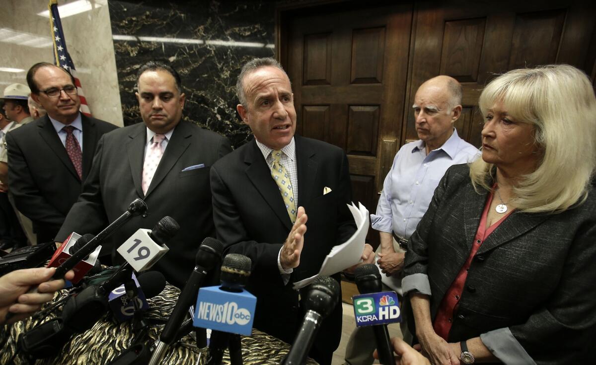 The compromise plan to reduce prison crowding is a significant victory for Gov. Jerry Brown, second from right, whether a three-judge federal panel accepts it or not. Senate leader Darrell Steinberg (D-Sacramento), center, discusses the compromise at a news conference in Sacramento on Monday.