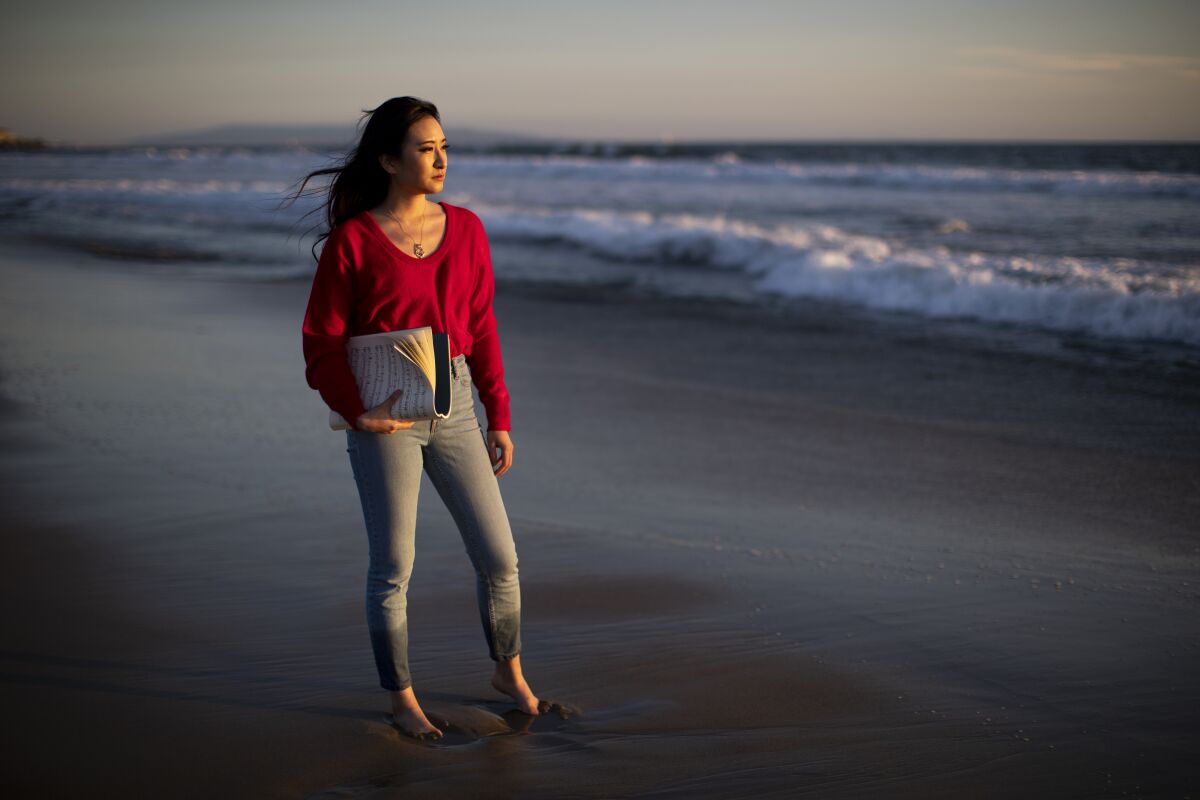 Pianist Sharon Su enjoys the sunset at the beach  in Santa Monica