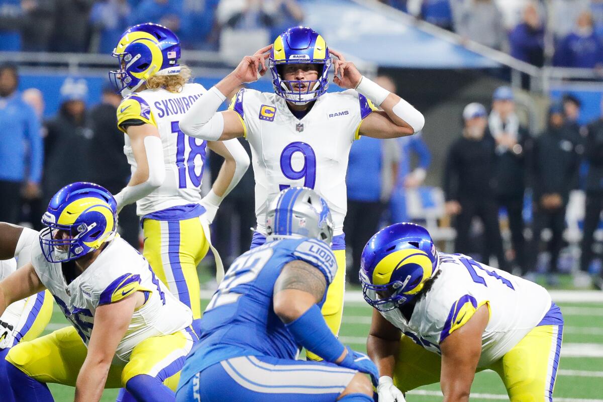 Rams quarterback Matthew Stafford (9) signals from the line against the Lions.