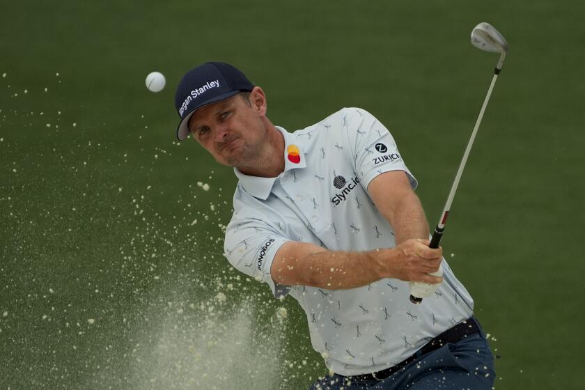 Justin Rose, of England, hits out of a bunker on the second hole during the first round of the Masters golf tournament on Thursday, April 8, 2021, in Augusta, Ga. (AP Photo/Gregory Bull)