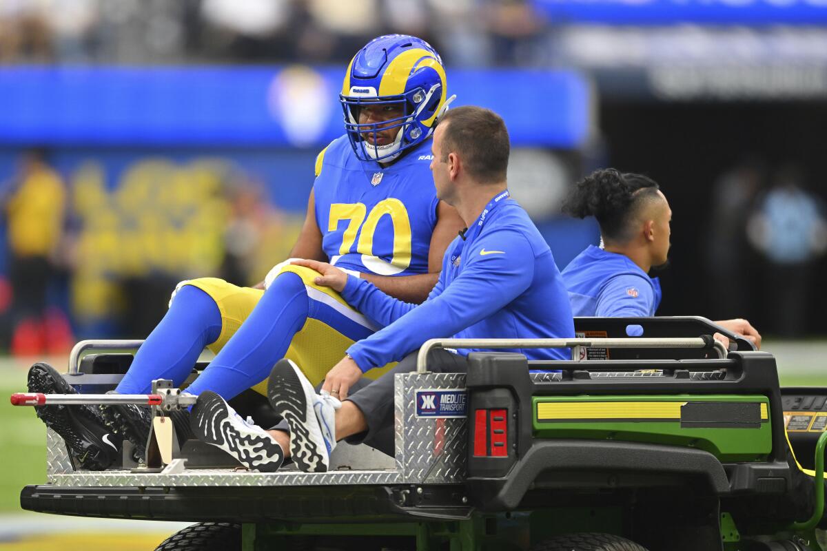 Rams offensive tackle Joe Noteboom is transported to the locker room after rupturing his Achilles tendon.