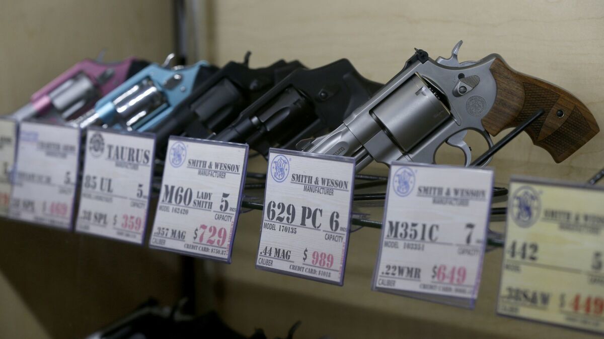 A federal law barring immigrants who are in the country without authorization does not violate the 2nd Amendment right to bear arms, an appeals court panel ruled Tuesday. Above, guns for sale at a store in the City of Industry.