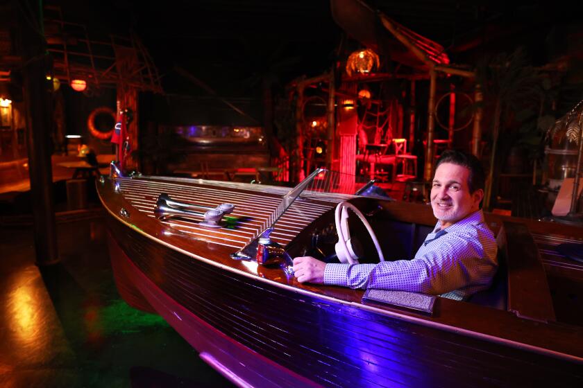 LOS ANGELES, CALIFORNIA June 4, 2024- Clifton's Republic owner Andrew Meieran sits in a boat on the top floor of the historic restaurant in Downtown Los Angeles. (Wally Skalij/Los Angeles Times)