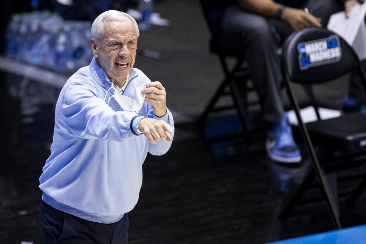 North Carolina coach Roy Williams points as he directs players during a game against Wisconsin.