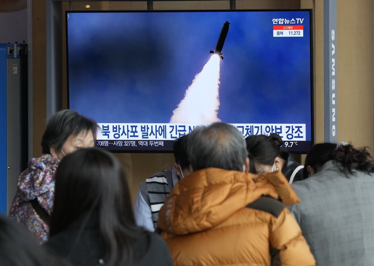 An image of a North Korean rocket launch is shown on a TV screen at the Seoul Railway Station on Sunday.