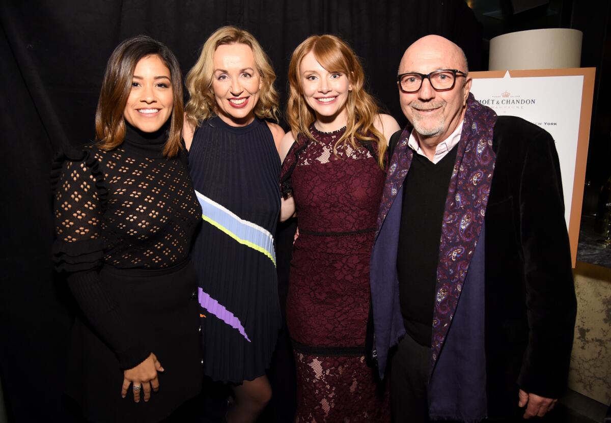 Gina Rodriguez, left, Elisabeth Sereda, Bryce Dallas Howard and Lorenzo Soria (president of the Hollywood Foreign Press Assn.) celebrate the launch of the Moët Moment Film Festival at Doheny Room on Wednesday.