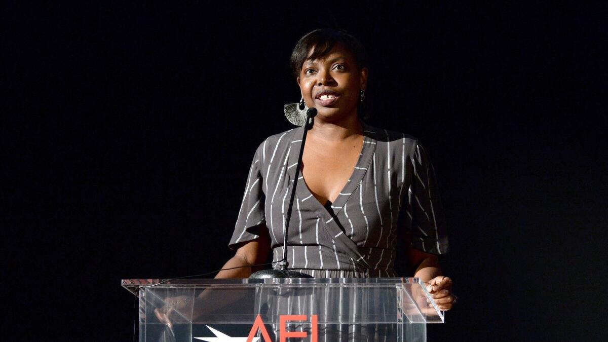 Festival director for AFI FEST Jacqueline Lyanga speaks onstage at the screening of "Molly's Game" at the closing night gala at AFI Fest 2017.
