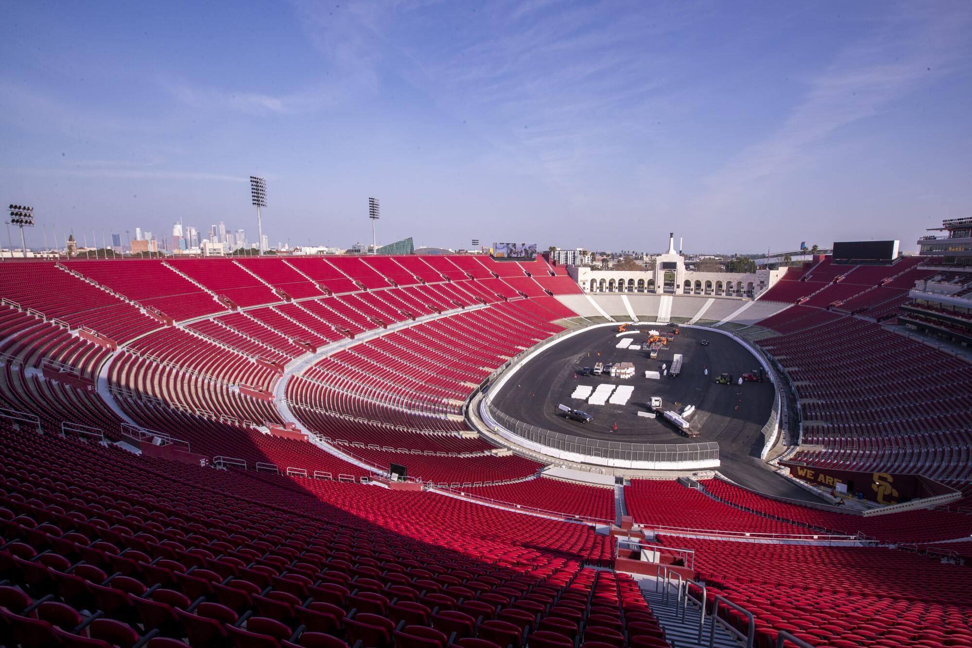 Construction crews transform theColiseum from a football stadium to a quarter-mile short track NASCAR exhibition race.