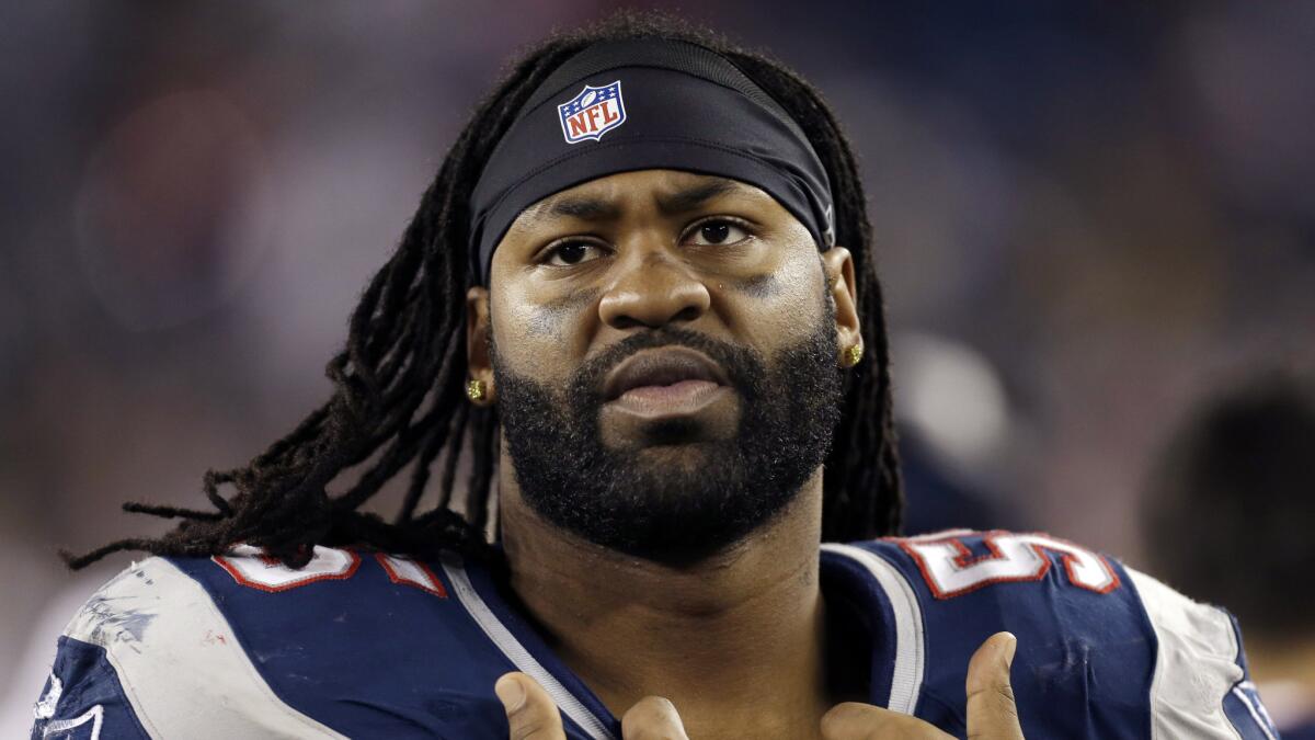 Brandon Spikes watches from the sideline during a New England Patriots game on Dec. 10, 2012. The former linebacker's 2011 AFC Championship ring, which was sold for close to $20,000 on EBay on Tuesday, has been stolen, his agent says.