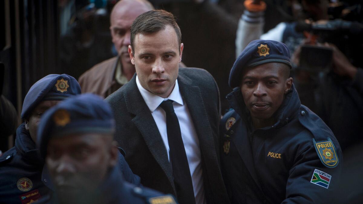 Oscar Pistorius arrives at the High Court in Pretoria, South Africa.