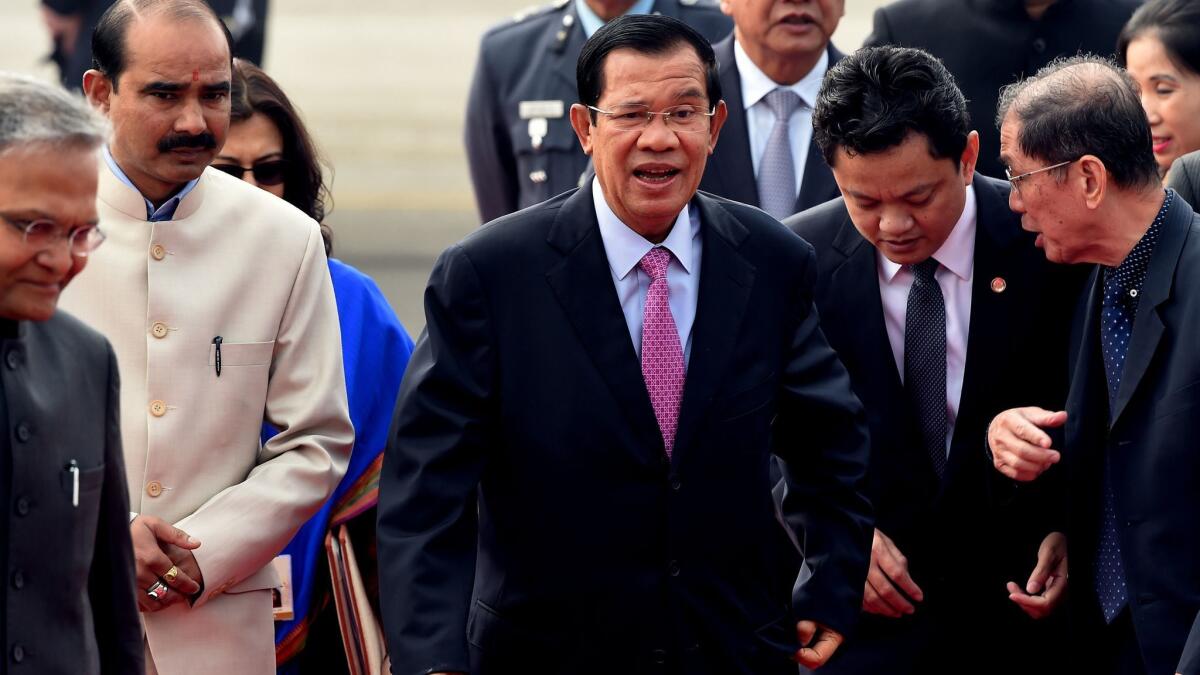 Cambodian Prime Minister Hun Sen, center, shown arriving for a meeting in New Delhi on Jan. 24, has established a reputation as a tough leader with a low tolerance for dissent.