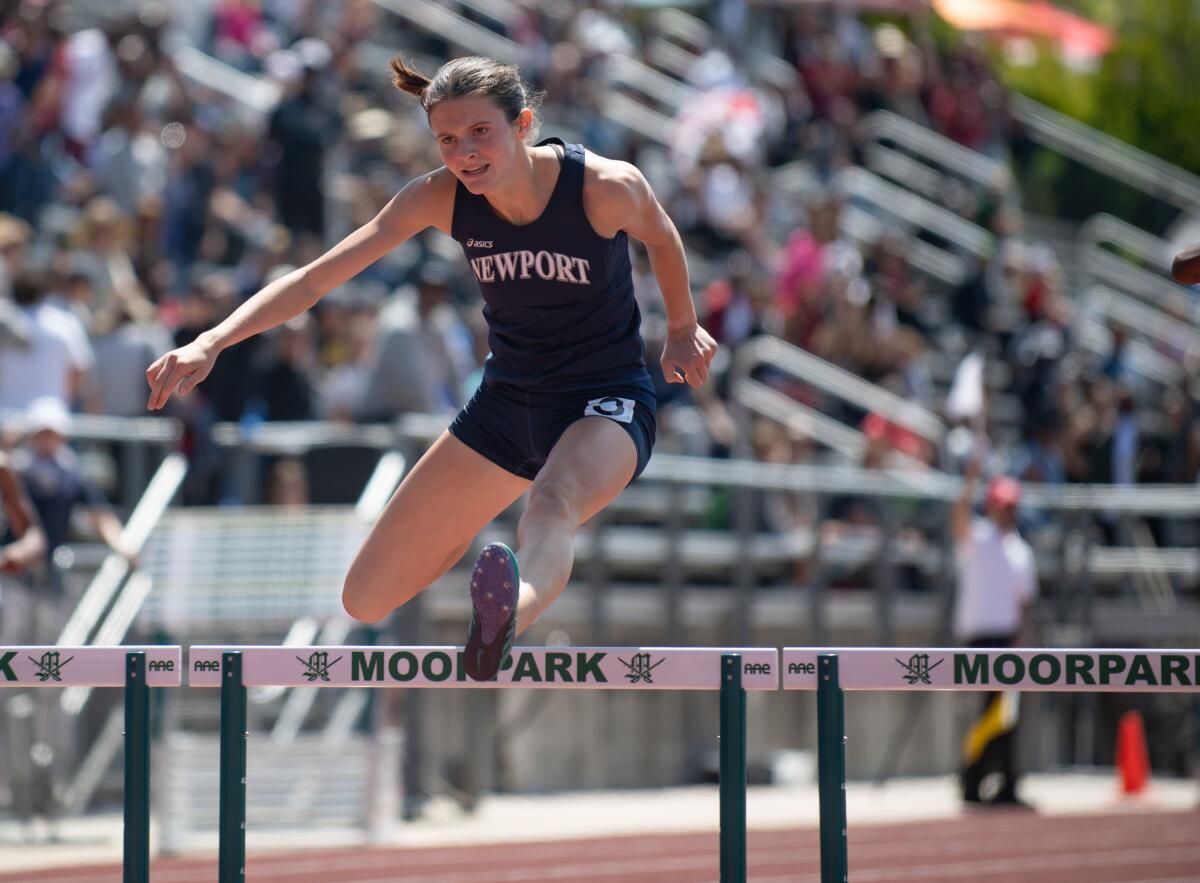Newport Harbor's Natalie McCarty competes in the 300-meter hurdles during the CIF Masters Meet at Moorpark High on Saturday.