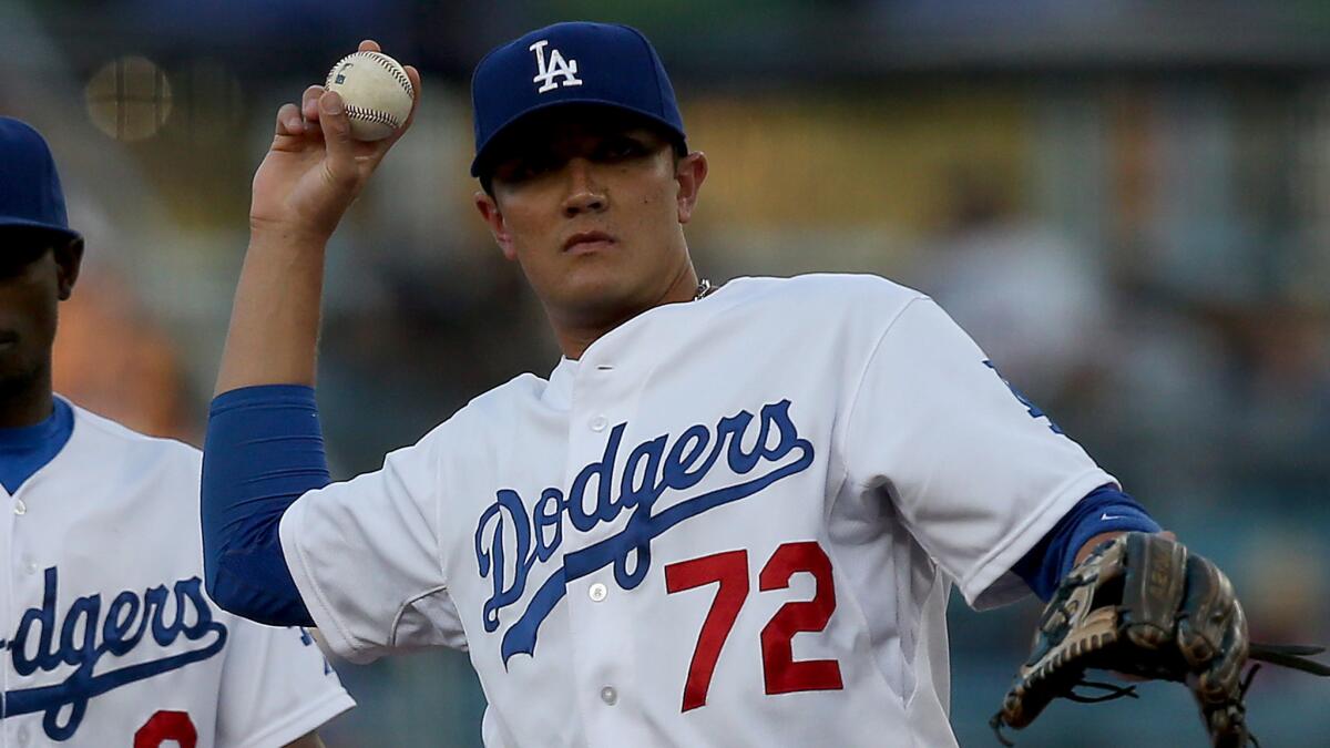 Dodgers shortstop Miguel Rojas throws to first base during a game against the St. Louis Cardinals on June 26.