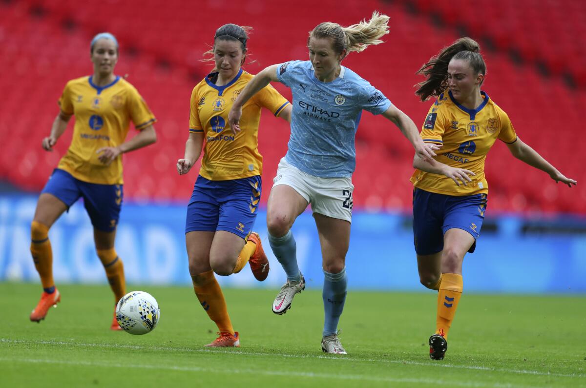 Manchester City's Sam Mewis controls the ball ahead of Everton players during the Women's FA Cup final on Nov. 1.