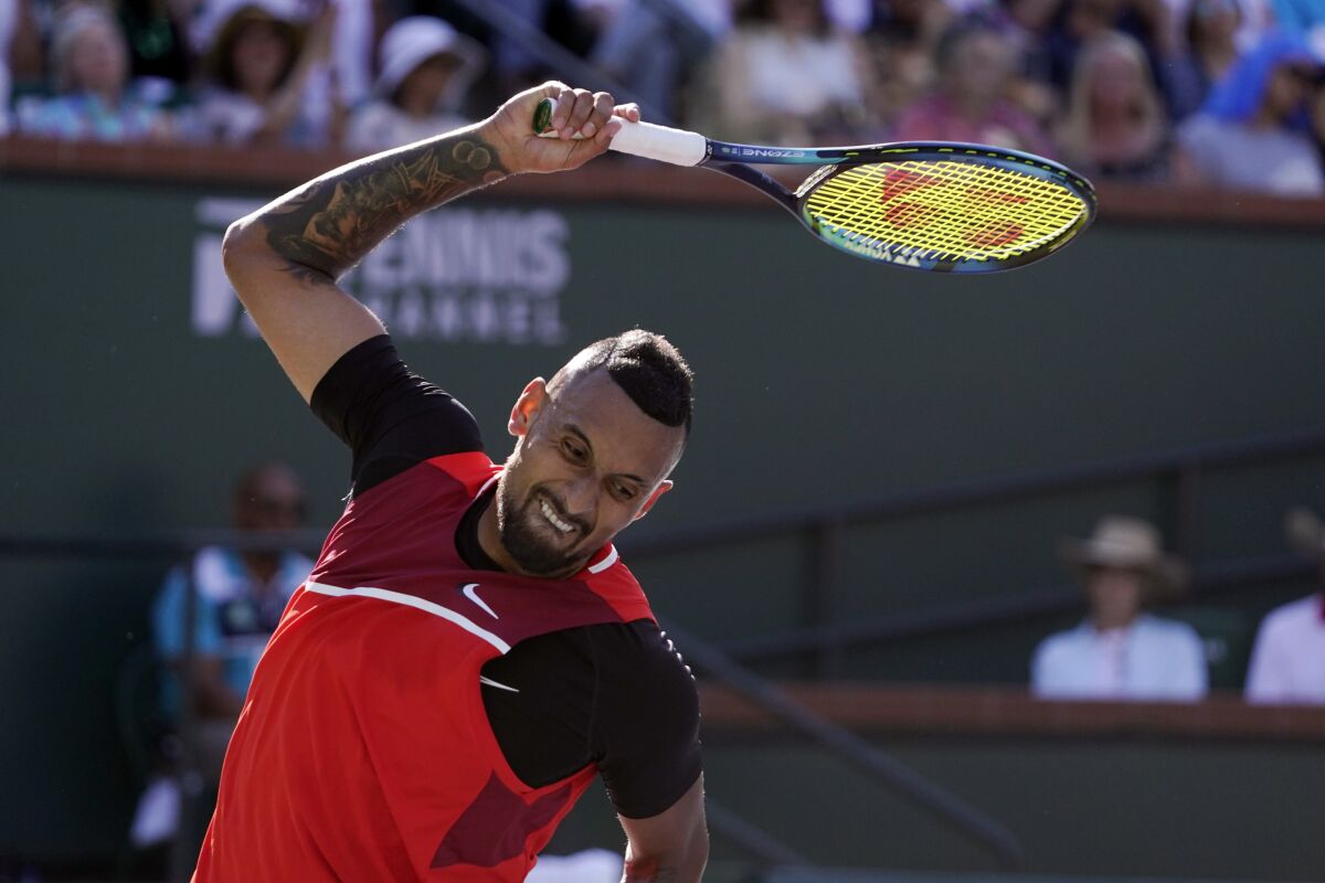 Nick Kyrgios tosses his racket after losing a point to Rafael Nadal.