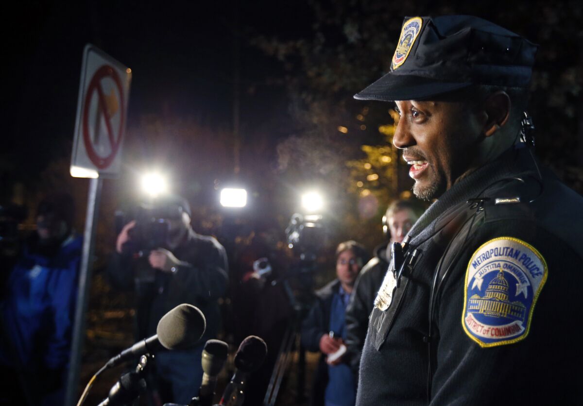 FILE - Washington Metro Police Lt. Jesse Porter speaks to the media, Dec. 11, 2013, in Washington. Porter, 58, and retired, was working for a private contractor providing training for a group of library police officers on how to use expandable batons when he discharged a single shot from his firearm, the Metropolitan Police Department said Friday, Aug. 5, 2022. The shooting happened around 3:30 p.m. Thursday inside a training room at the District of Columbia public library in the city’s Anacostia neighborhood. (AP Photo/Alex Brandon, File)