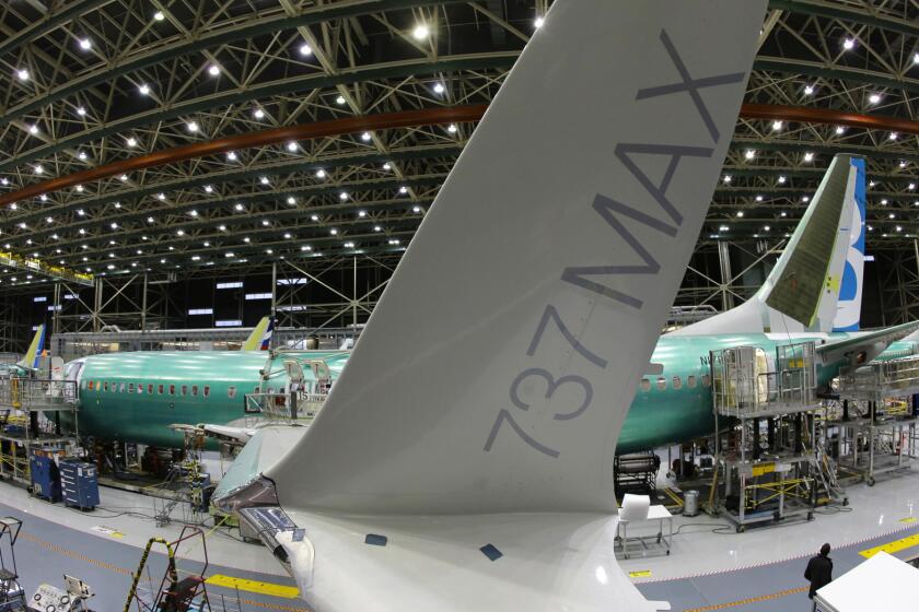 In this Monday, Dec. 7, 2015, photo, taken with a fisheye lens, the distinctive winglet on the second Boeing 737 MAX airplane being built is shown on the assembly line in Renton, Wash. On Thursday, March 3, 2016, the Commerce Department reports on U.S. factory orders for January. (AP Photo/Ted S. Warren)