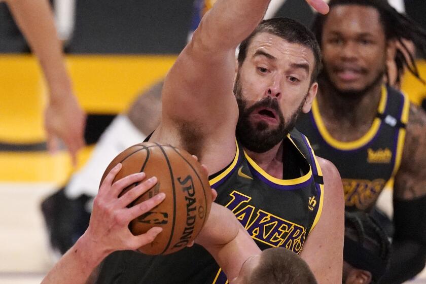 Lakers cenre Marc Gasol attempts to block a shot by Nuggets center Nikola Jokic on May 3, 2021, at Staples Center.