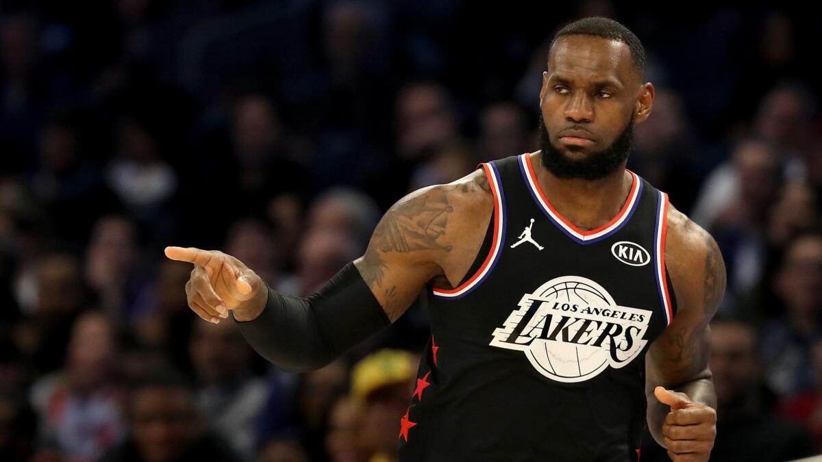 Lakers star LeBron James reacts during the first half of the NBA All-Star game in Charlotte on Sunday.
