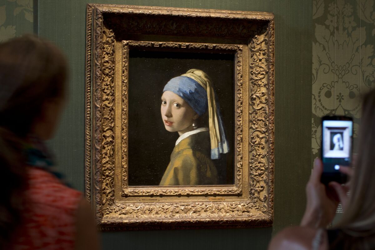 Blonde Girl with a Pearl Earring by Johannes Vermeer - wide 2