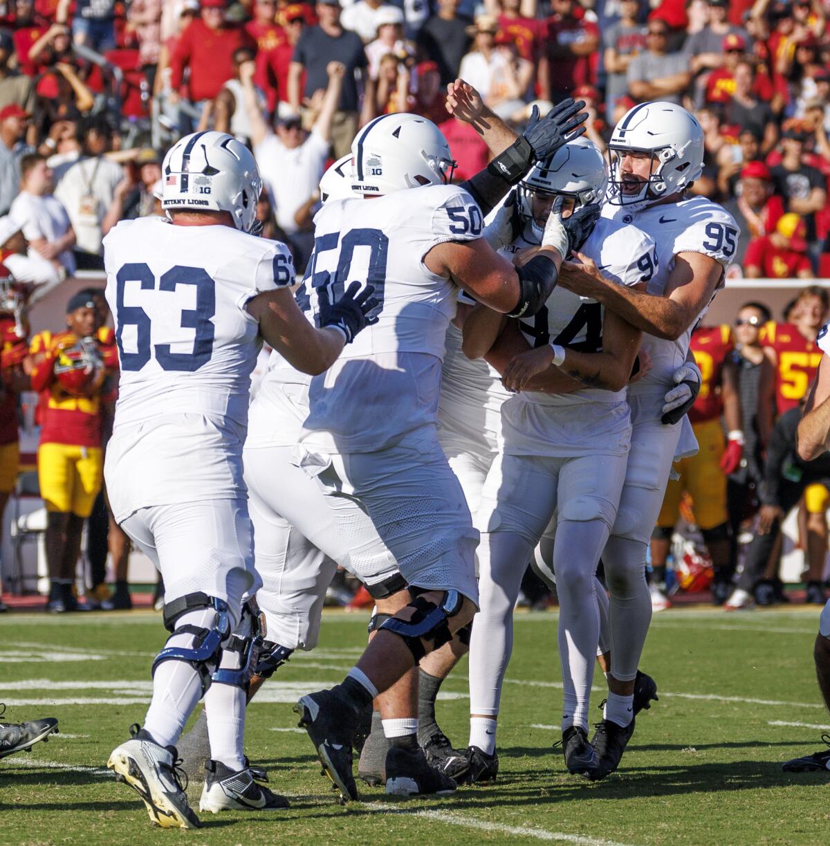 Penn State’s Ryan Barker celebrates with teammates after kicking a 36-yard field goal in overtime.