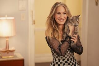 Sarah Jessica Parker holds her new cat "Shoe" which she adopted from the set of Max's "And Just Like That."