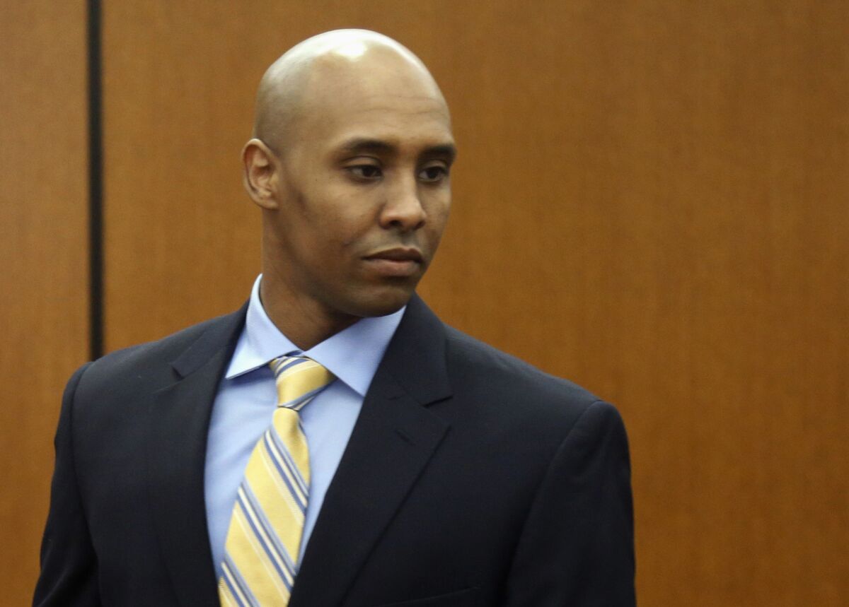 FILE - In this May 8, 2018, file photo, Mohamed Noor arrives at the Hennepin County Government Center for a hearing in Minneapolis. A date has been set for Noor to be re-sentenced on his manslaughter conviction. Noor will be sentenced on Oct. 21, 2021. (AP Photo/Jim Mone, File)
