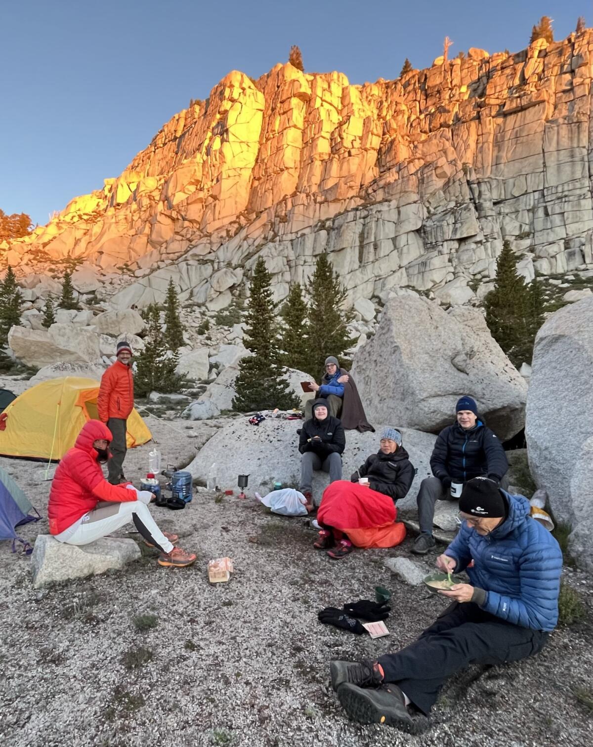 Eline ?idvin, third from right, joins her guides for a sunrise breakfast at 11,000 feet at their base camp.