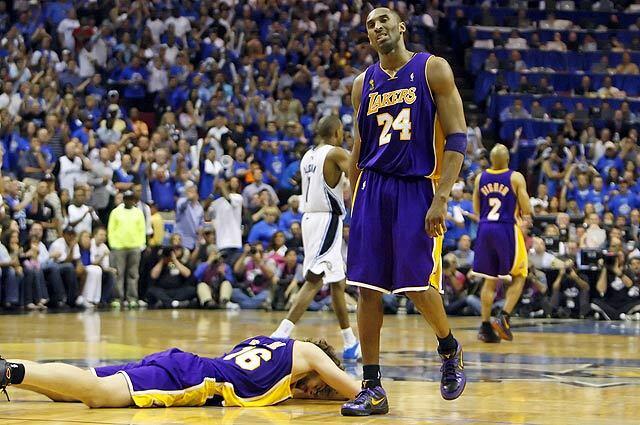 Kobe Bryant and Pau Gasol show their disgust at mid-court after fumbling away a chance to tie the game against Orlando late in Game 3 of the NBA Finals at Amway Arena.