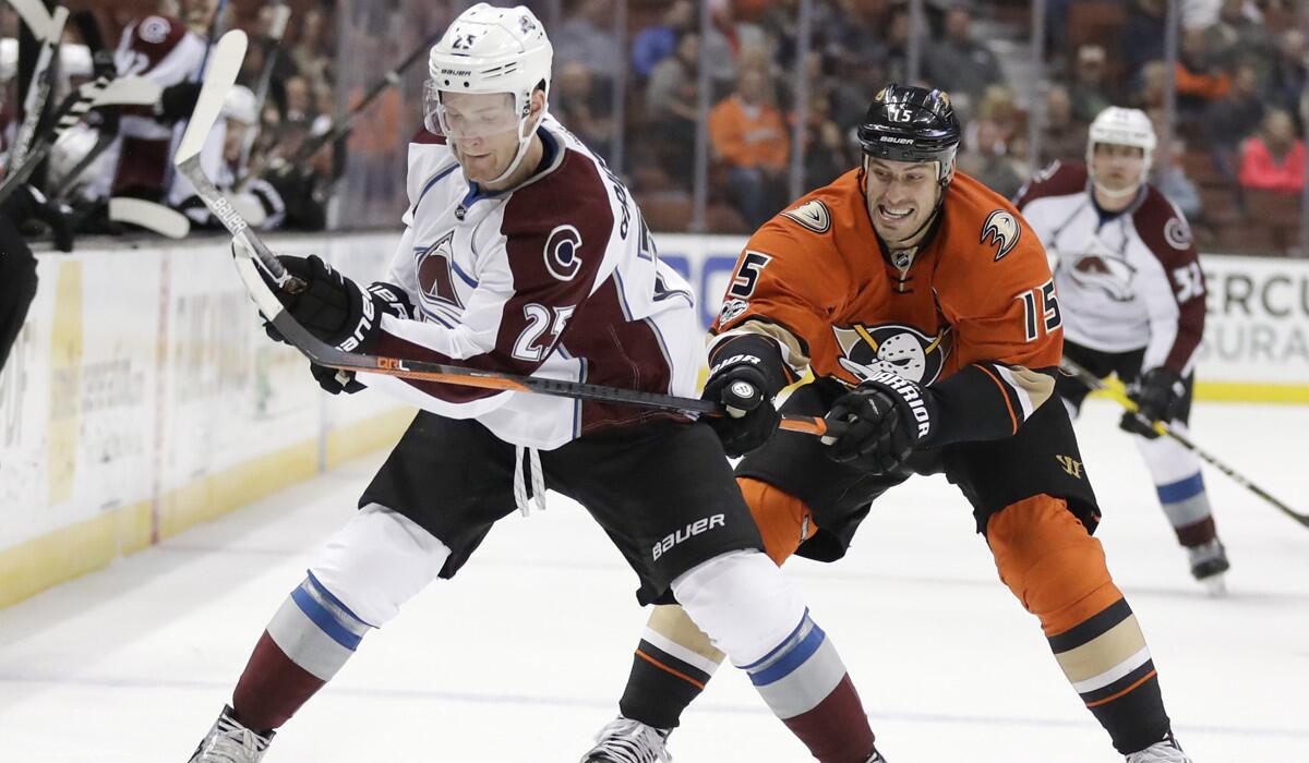 Colorado Avalanche center Mikhail Grigorenko, left, vies for the puck with Ducks center Ryan Getzlaf during the first period Tuesday.