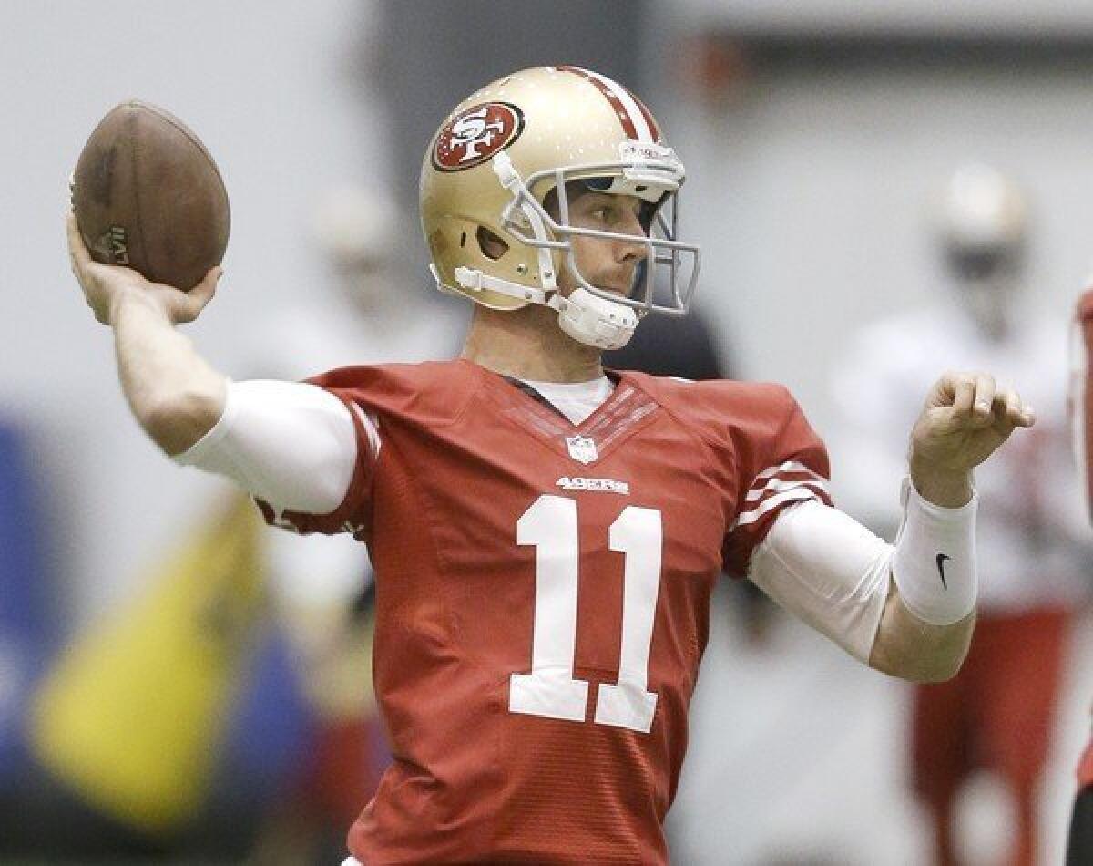 San Francisco quarterback Alex Smith passes during a practice in New Orleans before the Super Bowl.