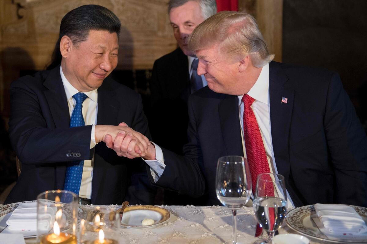 President Trump and Chinese President Xi Jinping shake hands during dinner at the Mar-a-Lago estate in West Palm Beach, Fla., on April 6.