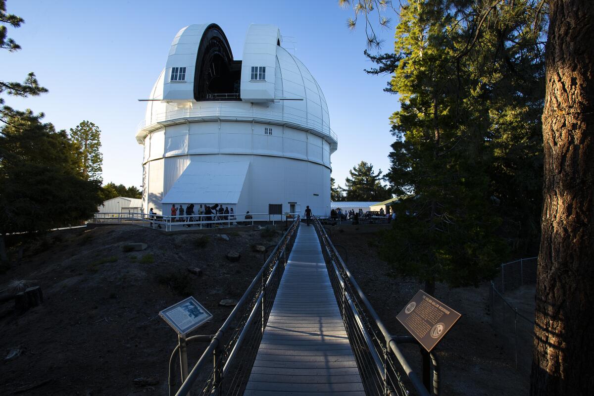 A path leads through the woods to the building that houses the 100-inch telescope at Mt. Wilson Observatory.