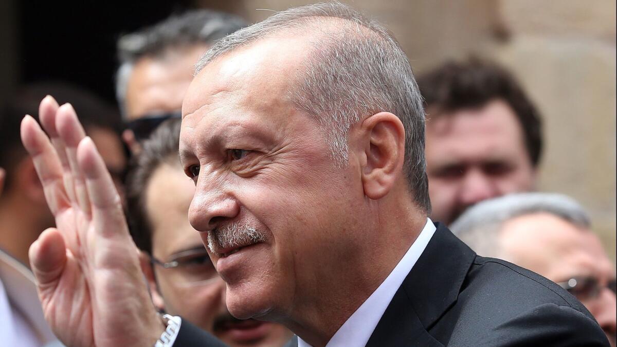 Turkey's President Recep Tayyip Erdogan saluting supporters after Friday prayers, in Bayburt,