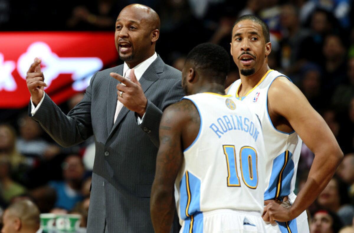Denver Nuggets Coach Brian Shaw and guards Nate Robinson (10) and Andre Miller on the sideline during a game in December against the Utah Jazz.