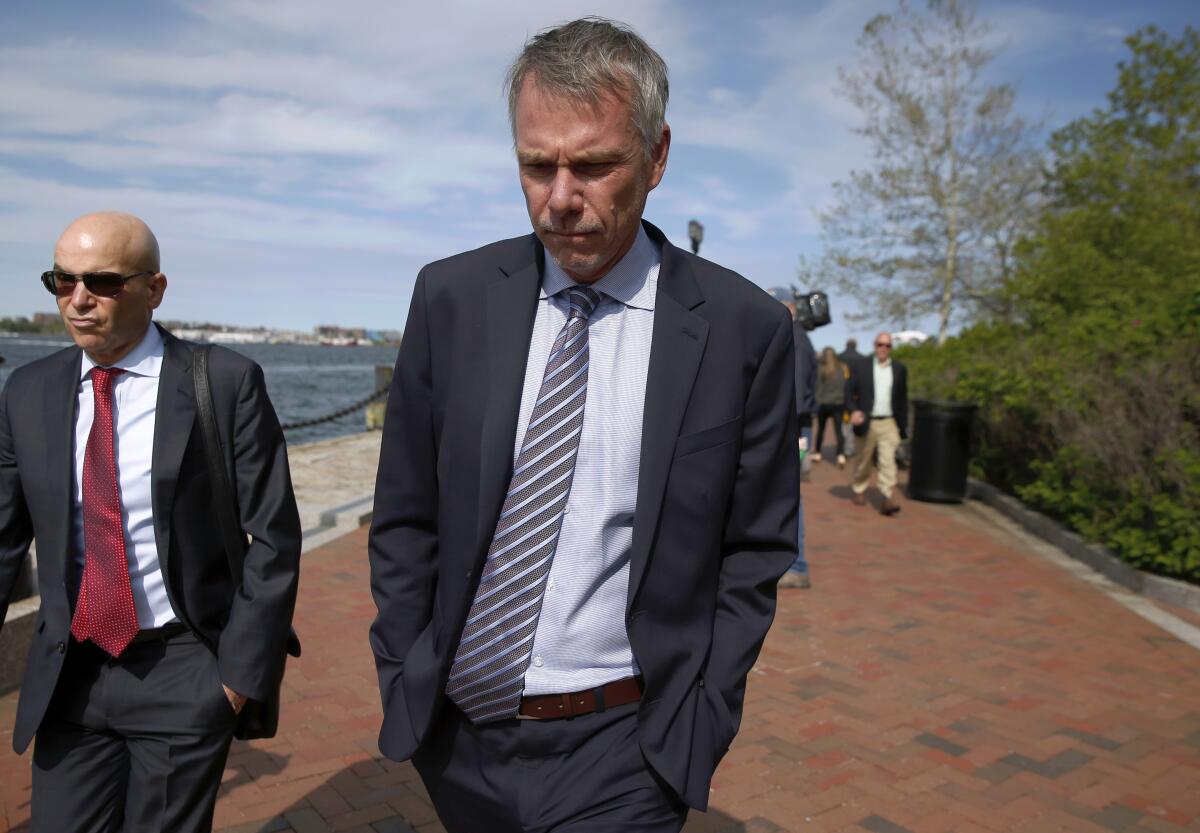 In this May 22, 2019 file photo, Jan Sartorio leaves federal court in Boston after pleading guilty to charges in a nationwide college admissions bribery scandal. Sartorio was sentenced on Friday to one year of probation.