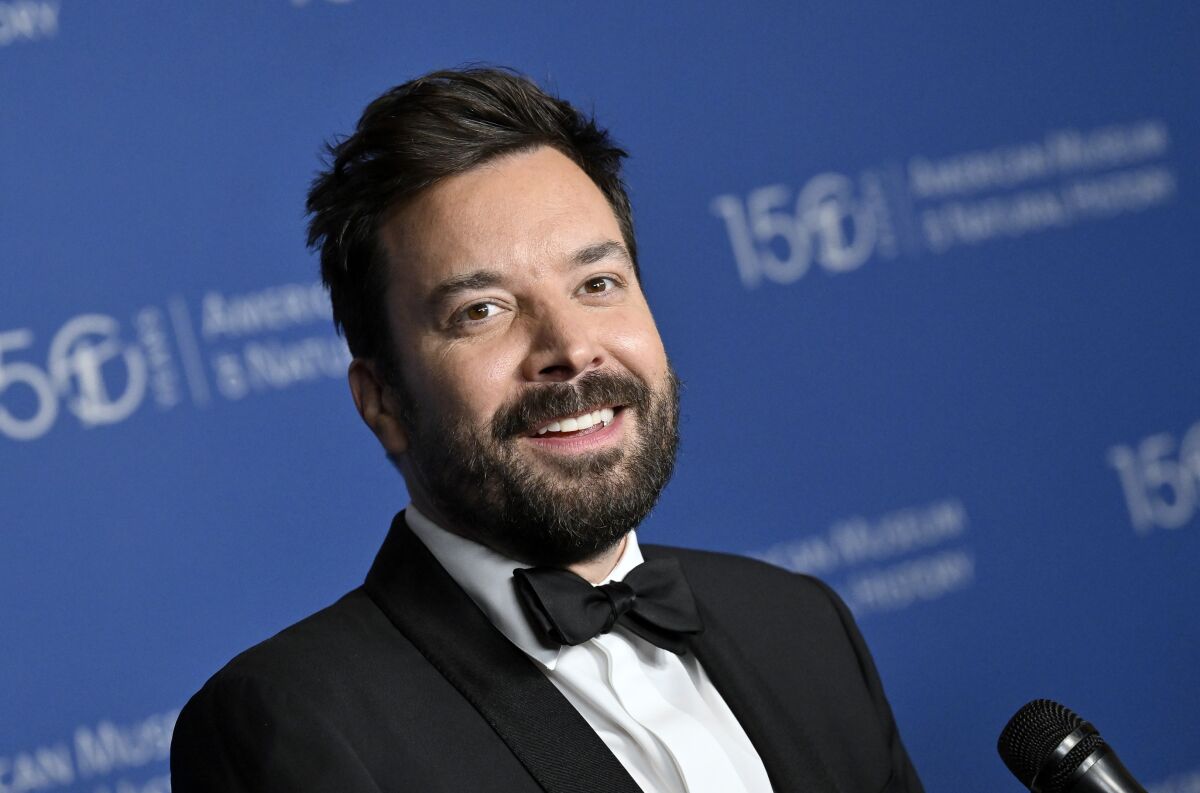 A man with a beard wearing a tuxedo and bow tie
