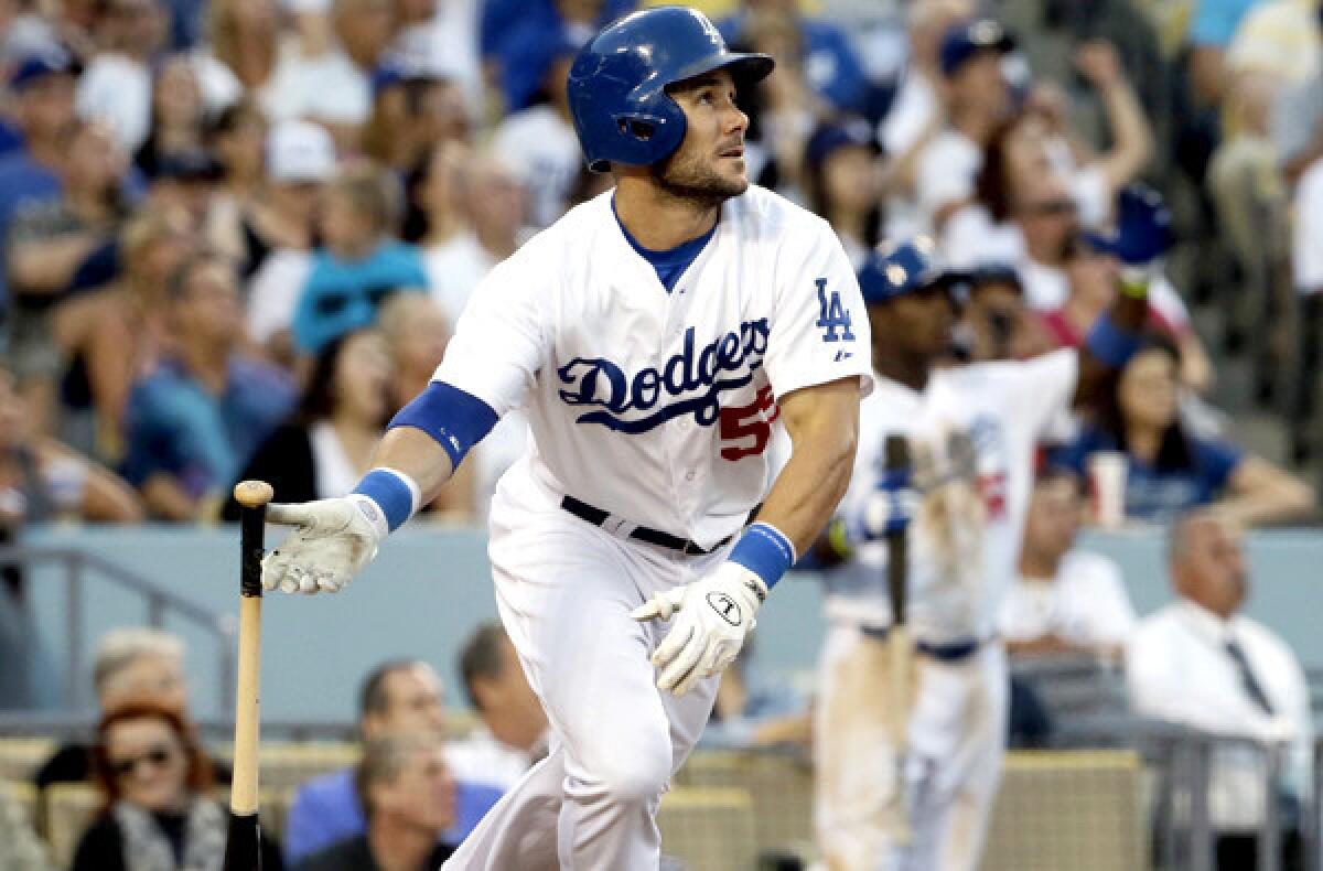 Dodgers left fielder Skip Schumaker watches his two-run home run head toward the center-field wall in the fifth inning Saturday night at Dodger Stadium.