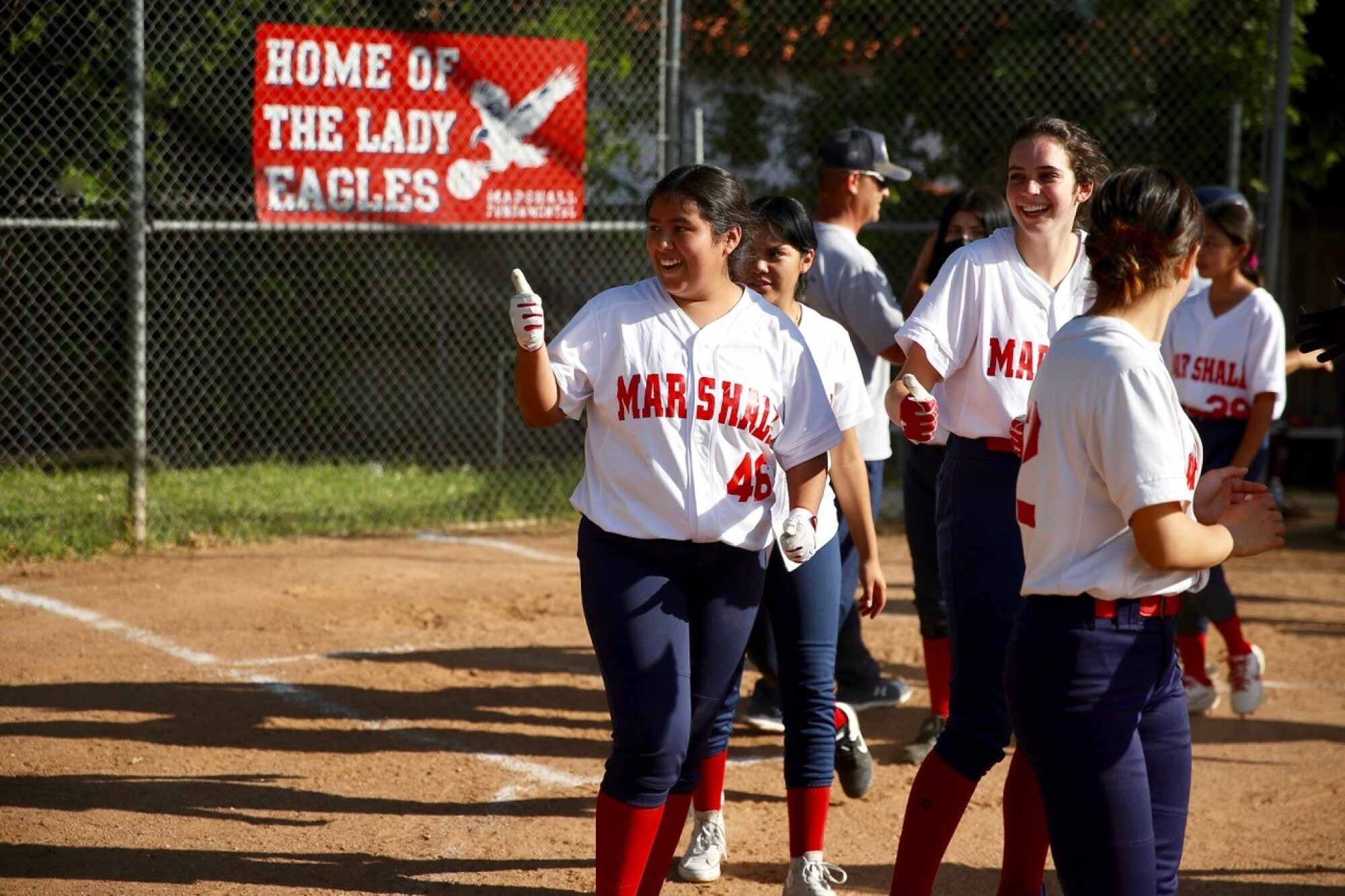 Marshall junior Desiree Lopez gives the thumbs-up to the opposing team.