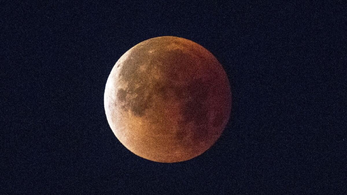 A super blue blood moon sets over Los Angeles on January 31, 2018.